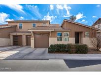 Inviting two-story home with a neatly landscaped front yard and attached garage at 1921 E Lantana Dr, Chandler, AZ 85286