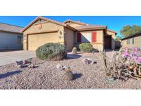 One-story home with desert landscaping and a two-car garage at 19572 N Sandalwood Dr, Maricopa, AZ 85138