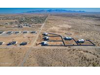 Aerial view of new homes and lots in a desert community at 23197 W Skinner Rd, Wittmann, AZ 85361