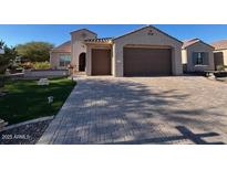 Beautiful one-story home with a large driveway and landscaped front yard at 2562 N 169Th Ave, Goodyear, AZ 85395