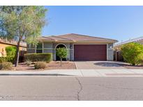 Single-story home with a two-car garage and landscaped front yard at 30723 N 25Th Dr, Phoenix, AZ 85085