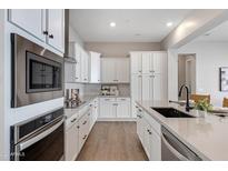 Modern kitchen with stainless steel appliances and ample counter space at 4072 E Las Colinas Dr, Chandler, AZ 85249
