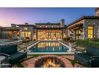 Luxury home with inviting pool, fire pit, and spacious patio at 42638 N Chiricahua Pass, Scottsdale, AZ 85262
