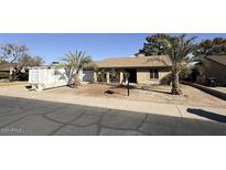 Ranch style home with mature landscaping and a spacious front yard at 14017 N 40Th Ave, Phoenix, AZ 85053