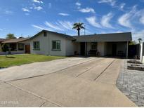 Charming single story home with a spacious front yard and long driveway at 1922 N 25Th St, Phoenix, AZ 85008