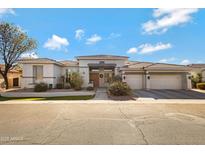 Beautiful single-story home with a three-car garage and landscaped front yard at 2181 W Thompson Pl, Chandler, AZ 85286