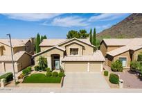 Two-story house with a three-car garage and landscaped yard at 23046 N 21St St, Phoenix, AZ 85024