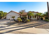 Single-story home with two-car garage, mature landscaping, and attractive curb appeal at 2336 Leisure World --, Mesa, AZ 85206