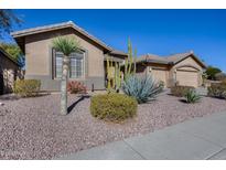 Single-story home with desert landscaping and two-car garage at 26646 N 46Th Pl, Cave Creek, AZ 85331