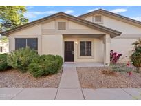 Inviting exterior with landscaping and a paved walkway at 310 N 65Th St # 9, Mesa, AZ 85205