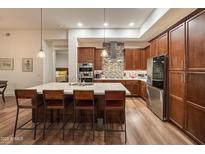 Modern kitchen with island, stainless steel appliances, and ample cabinetry at 5250 E Deer Valley Dr # 403, Phoenix, AZ 85054