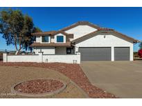 Two-story house with gray double garage and landscaped yard at 6328 N 126Th Ave, Litchfield Park, AZ 85340