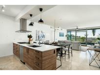 Modern kitchen with stainless steel appliances and an island at 7120 E Kierland Blvd # 311, Scottsdale, AZ 85254