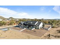 Expansive property with modern farmhouse, desert landscaping, and mountain views at 8169 E Redberry --, Mesa, AZ 85207