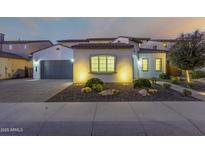 Stunning two-story home with a three-car garage and landscaped front yard at 9430 W Jj Ranch Rd, Peoria, AZ 85383