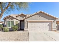 Single-story house with a two-car garage and desert landscaping at 19339 N Madison Rd, Maricopa, AZ 85139