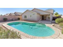 Inviting kidney-shaped pool in a backyard setting at 19339 N Madison Rd, Maricopa, AZ 85139