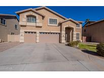 Two-story house with a large driveway and landscaping at 2734 E Birchwood Pl, Chandler, AZ 85249