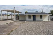 Charming single story home with carport and gravel driveway at 5039 N 18Th Ave, Phoenix, AZ 85015