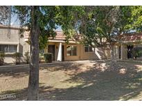 Front view of a charming single-story home with mature landscaping at 17242 N 16Th Dr # 9, Phoenix, AZ 85023