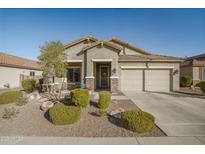 Single-story home with landscaped yard and two-car garage at 25940 W Oraibi Dr, Buckeye, AZ 85396