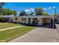 House exterior showcasing a covered carport and front yard at 303 W 9Th St, Mesa, AZ 85201