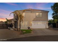 Two-story house with a large garage and landscaped front yard at 3141 S 83Rd Cir, Mesa, AZ 85212