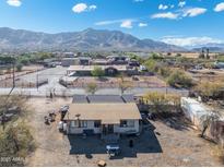 Aerial view of a house and surrounding area, showcasing the property's location and landscape at 3204 W Mcneil St, Laveen, AZ 85339