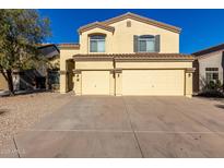 Two-story house with a three-car garage and desert landscaping at 3482 W Mineral Butte Dr, San Tan Valley, AZ 85144