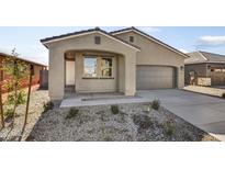 New construction home exterior with a two-car garage and landscaped front yard at 37535 W Patterson St, Maricopa, AZ 85138