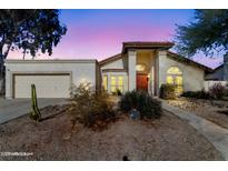 Attractive single-story home with desert landscaping and a two-car garage at 408 W Straford Dr, Chandler, AZ 85225