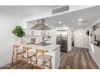 Modern kitchen with stainless steel appliances and white shaker cabinets at 4411 N 40Th St # 52, Phoenix, AZ 85018