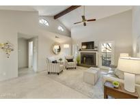 Bright living room with fireplace, vaulted ceiling and access to patio at 5505 E Mclellan Rd # 99, Mesa, AZ 85205