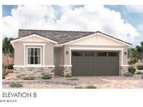 One-story home with a two-car garage and stone accents at 8333 N 54Th Ln, Glendale, AZ 85302