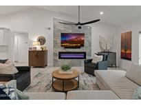 Spacious living room featuring a modern fireplace and ample seating at 10248 E San Salvador Dr, Scottsdale, AZ 85258