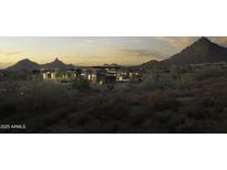 Luxury home nestled in mountains; expansive property with desert landscaping at 10784 E Pinnacle Peak Rd, Scottsdale, AZ 85255