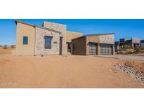 Stunning modern home with stone accents and a three-car garage at 11972 E Yearling Rd # 20, Scottsdale, AZ 85255