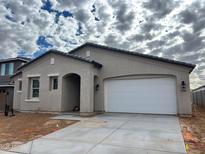 Newly constructed single-story home with a two-car garage and neutral color scheme at 19449 W Valle Vista Way, Litchfield Park, AZ 85340