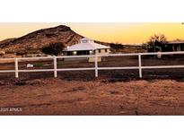 A charming one-story home with a fenced yard and mountain views at 201 E Sabrosa Dr, New River, AZ 85087