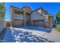 Two-story house with three-car garage and stone accents at 23116 N 41St St, Phoenix, AZ 85050