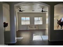 Bright living room with hardwood floors and ceiling fans at 4072 S Skyline Ct, Gilbert, AZ 85297