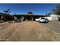 Ranch style home with carport and mature landscaping at 7320 N 29Th Ave, Phoenix, AZ 85051