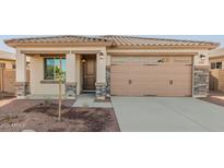 Single-story home with attached garage and desert landscaping at 17449 W El Caminito Dr, Waddell, AZ 85355