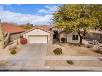 Single-story home with a two-car garage and landscaped front yard at 2422 E Durango Dr, Casa Grande, AZ 85194