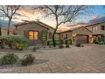 Spanish style home with brick accents and landscaped front yard at 3172 S Mulberry Ct, Gold Canyon, AZ 85118