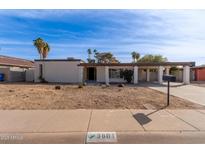 Single-story house with carport and landscaped yard at 3801 W Mercer Ln, Phoenix, AZ 85029