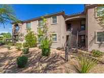 Exterior view of a two-story building with landscaping and stairs at 14815 N Fountain Hills Blvd # 201, Fountain Hills, AZ 85268