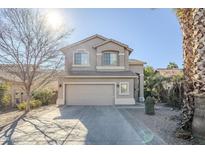 Two-story house with a two-car garage and desert landscaping at 14971 W Desert Hills Dr, Surprise, AZ 85379