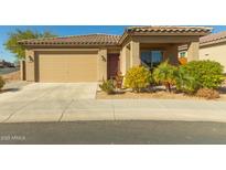 Single-story home with a two-car garage and landscaped front yard at 1840 S Vista Rd, Apache Junction, AZ 85119