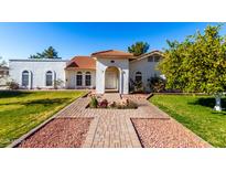 Beautiful single-story home with a well-manicured lawn and walkway at 460 S Sunnyvale --, Mesa, AZ 85206